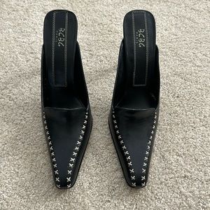BCBG black leather mules with stitch details on upper size 8.5